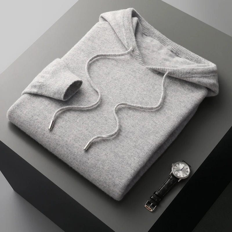 Ribbed cuffs and hem on a comfortable men's luxury hoodie. Adjustable drawstring hood, stylish casual pullover.