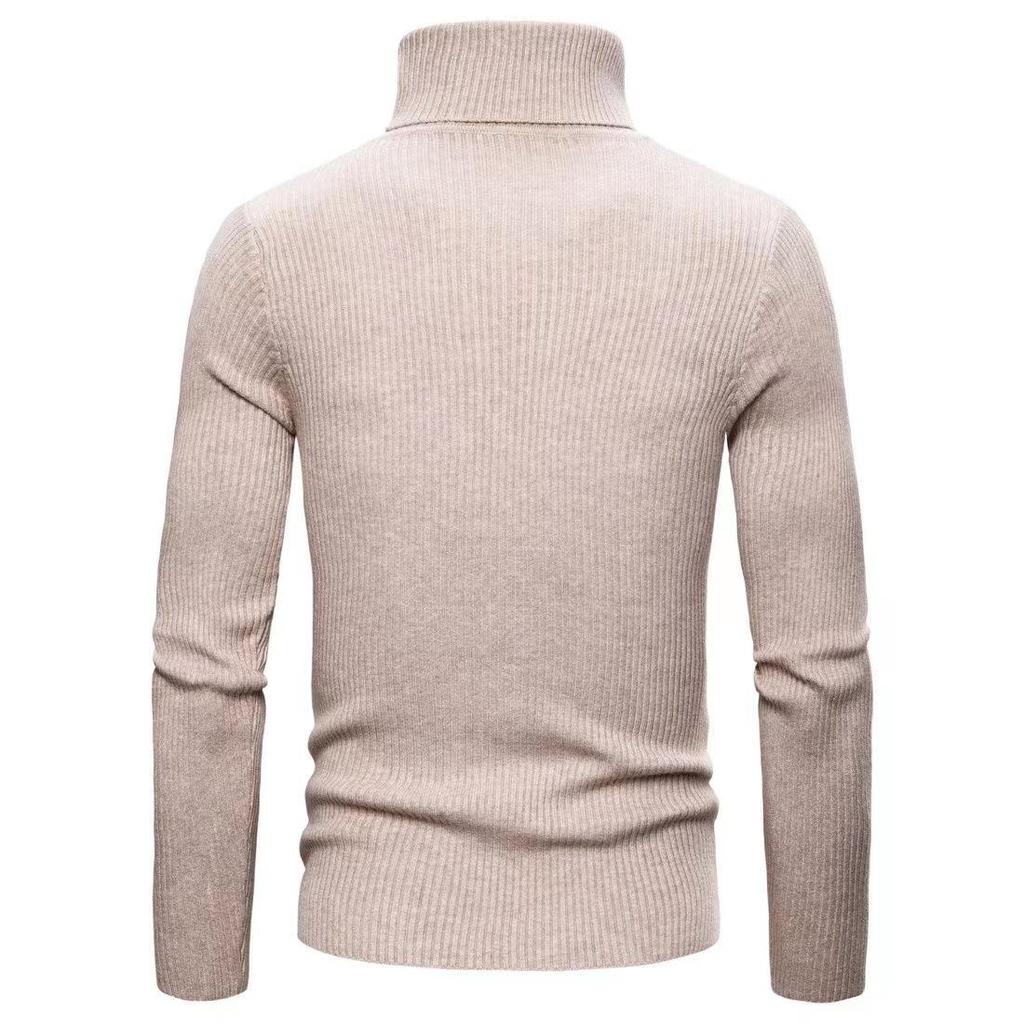 Styling suggestion: Men's black turtleneck sweater layered under a blazer