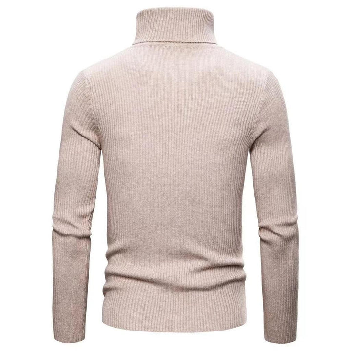 Styling suggestion: Men's black turtleneck sweater layered under a blazer