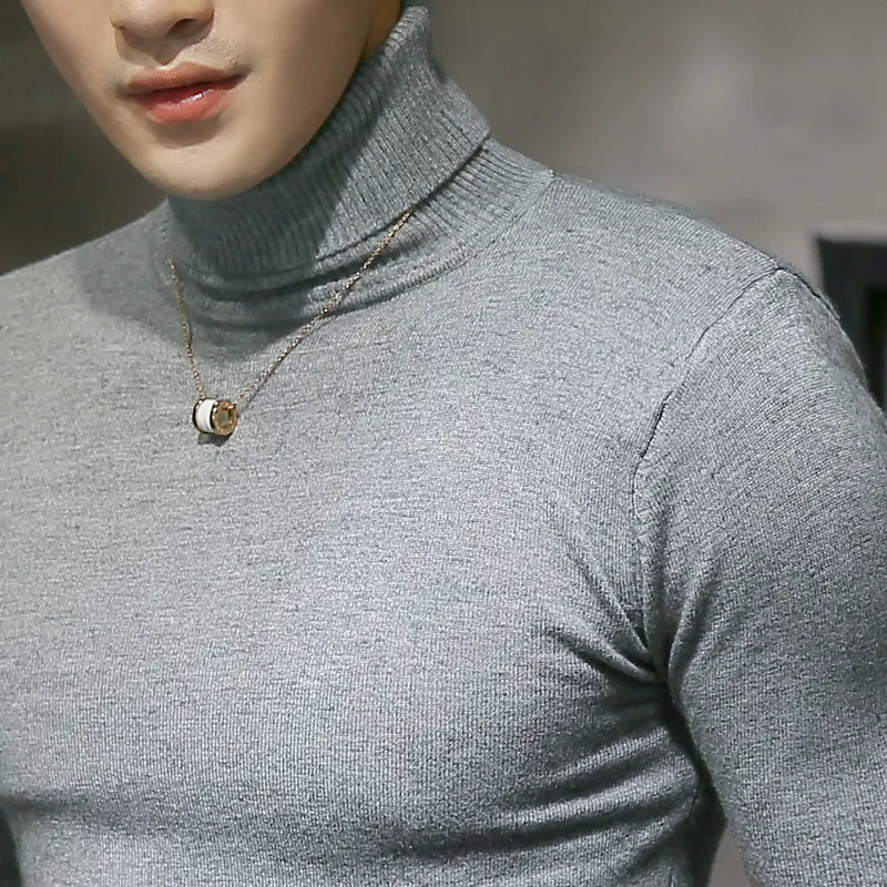 A man enjoying comfortable casual wear in a cream Merino wool turtleneck