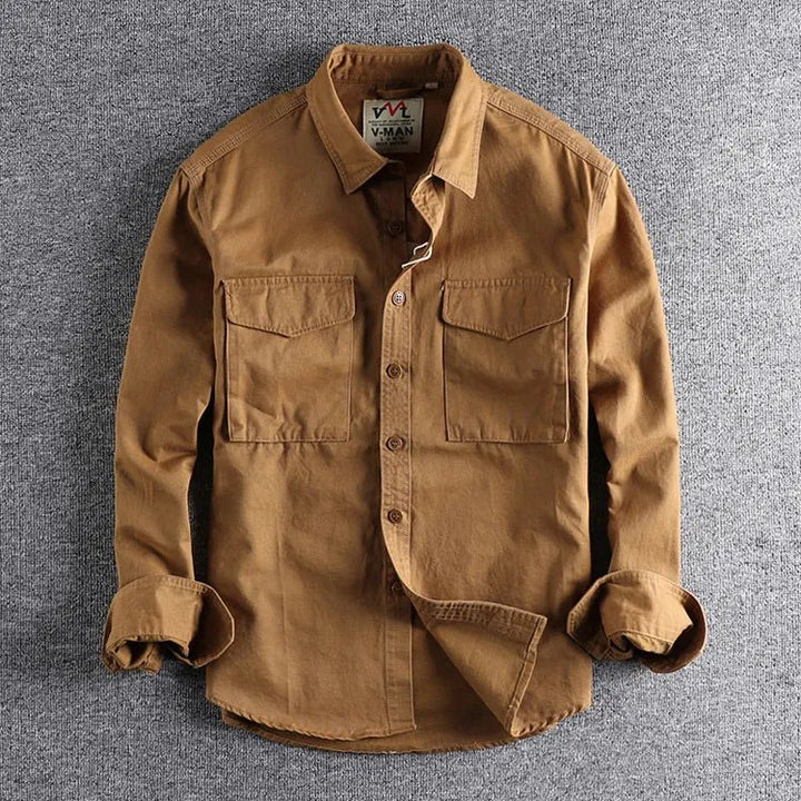 Khaki men's durable utility work shirt. Functional long sleeve button-down for casual or work wear.