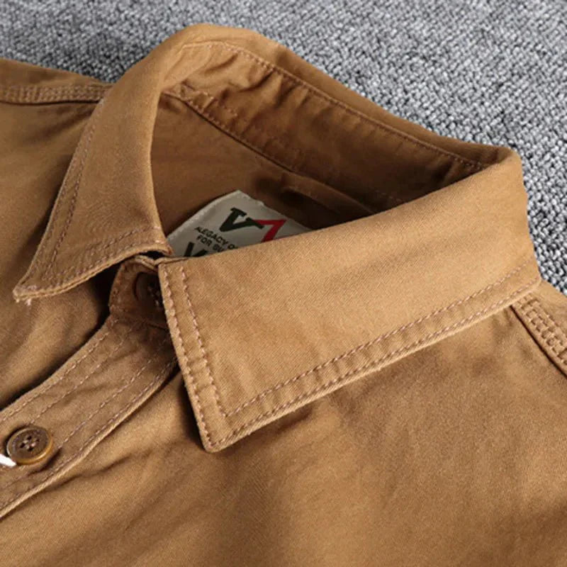 Marine blue men's long sleeve utility button-down shirt. Versatile casual workwear for men.