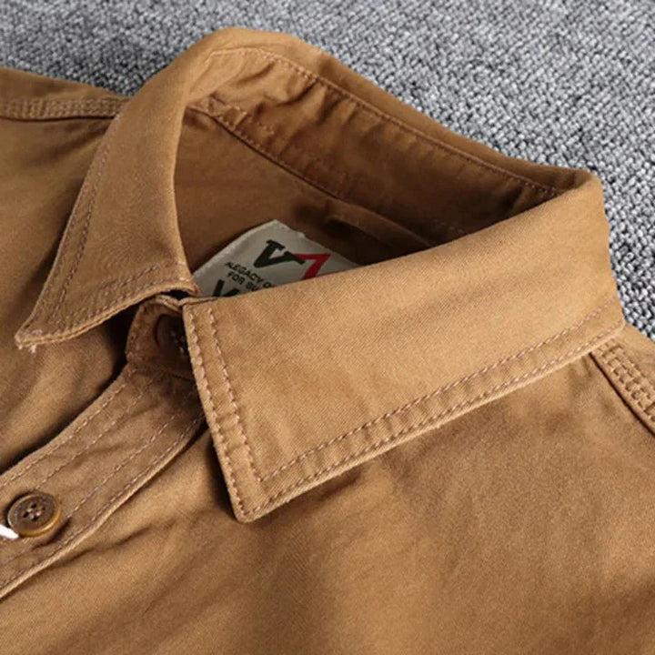 Marine blue men's long sleeve utility button-down shirt. Versatile casual workwear for men.
