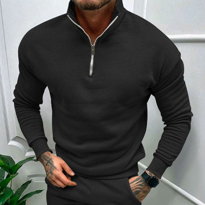 Man wearing a casual men's long sleeve half zip pullover jumper, ideal for comfortable everyday minimalist style.