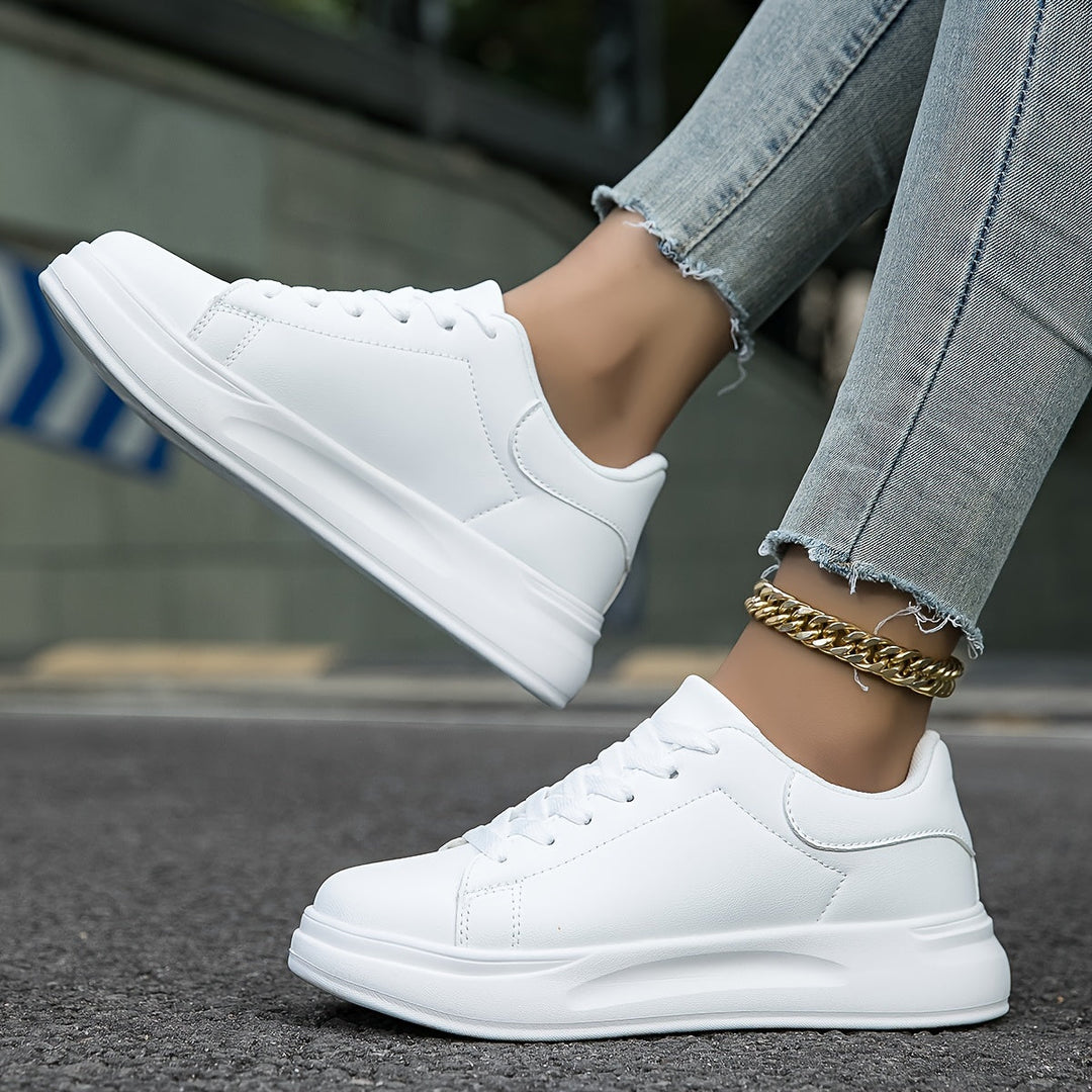 Classic white and black men's sneakers, minimalist footwear for versatile street style.