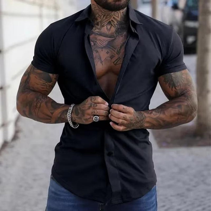 Model wearing a men's fitted modern short sleeve shirt, showcasing summer fashion.