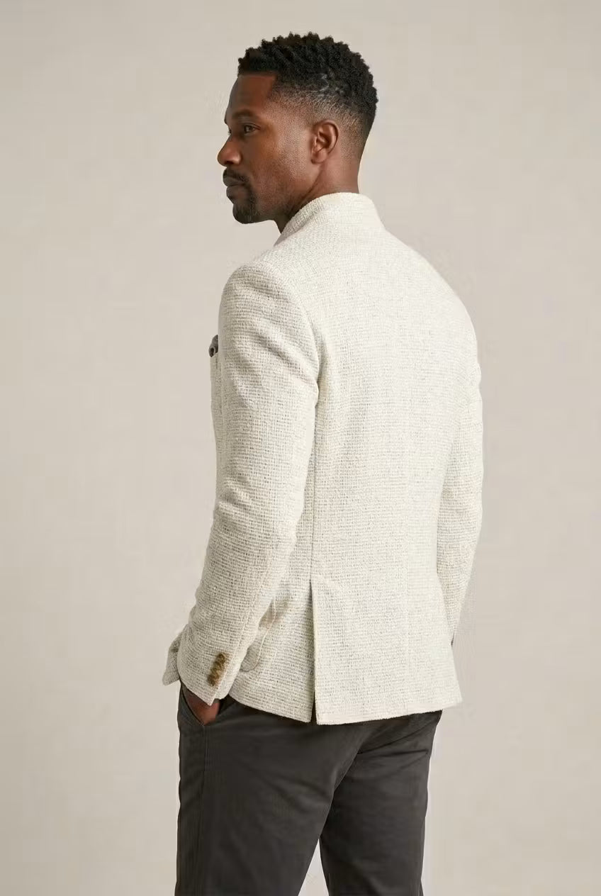 Single-breasted men's mandarin collar blazer, textured, offering a refined modern smart casual look.