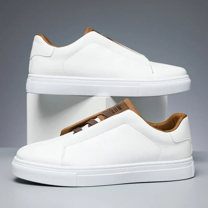 Pair of white men's slip-on sneakers, perfect for everyday smart casual wear.