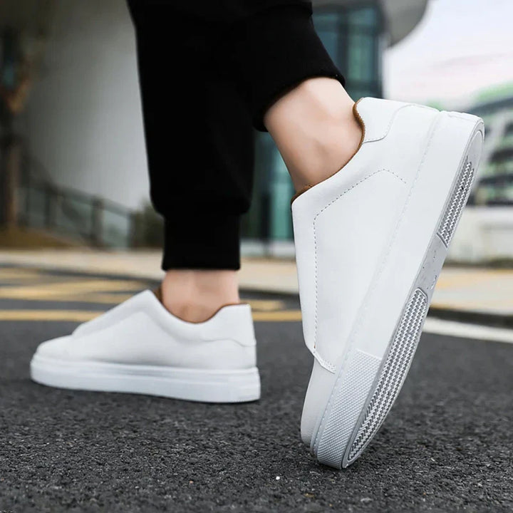 Comfortable white men's everyday shoes, slip-on trainers with a modern aesthetic.