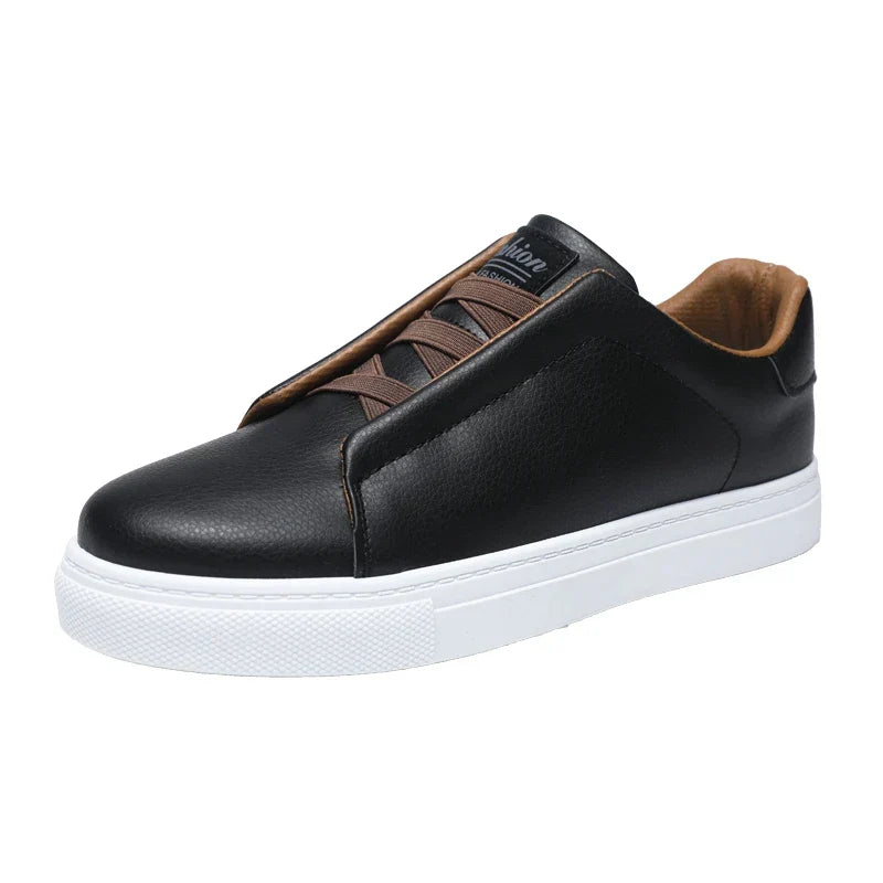 Stylish navy blue men's sneakers, slip-on style with a contrasting white sole.