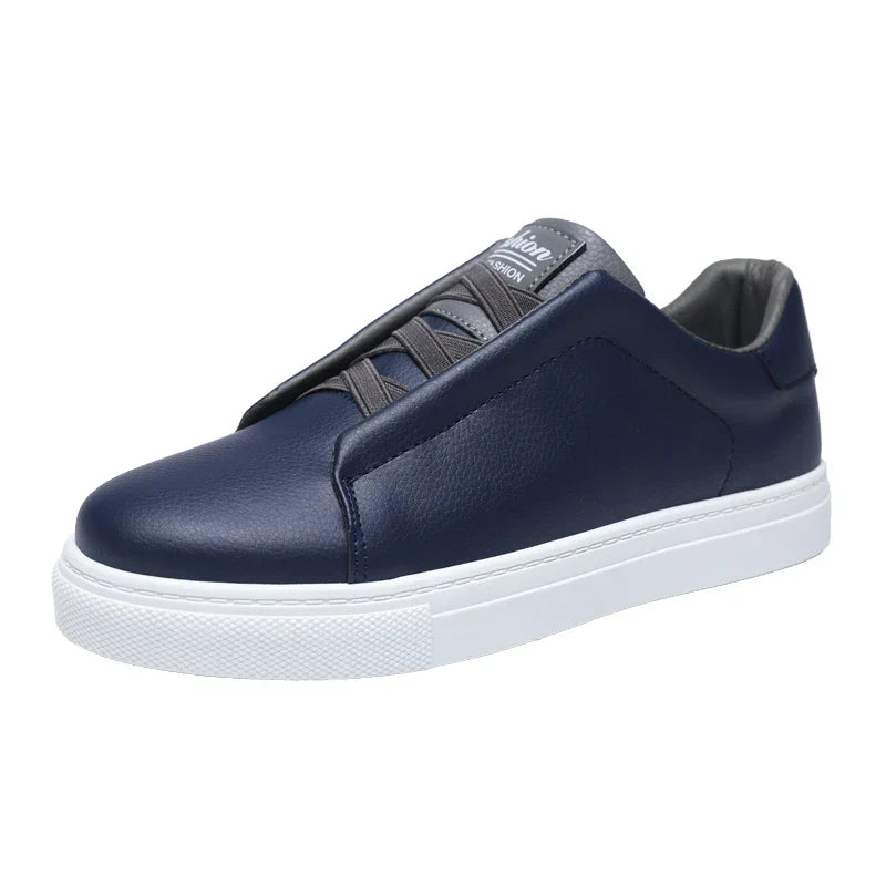 Detail shot of a black men's smart casual shoe, showcasing the slip-on feature and sole.