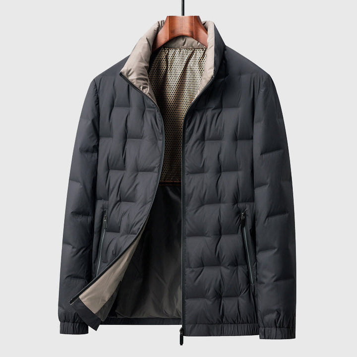 Modern men's lightweight quilted jacket with stand collar & full zip. Versatile casual outerwear.