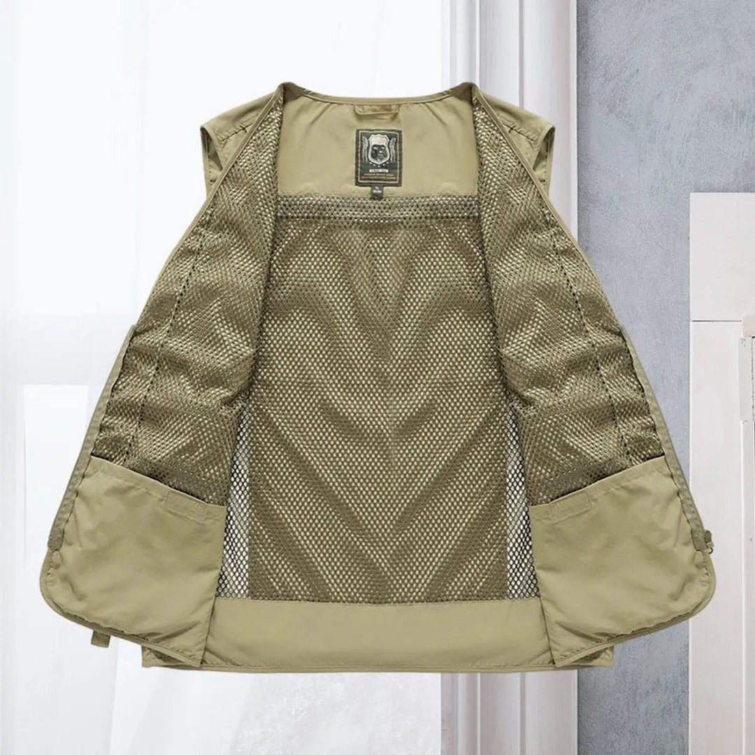 Durable men's outdoor utility vest with multiple pockets for fishing, hiking, & travel.