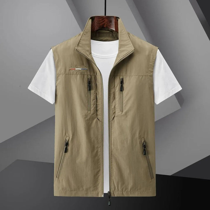 Water-resistant men's travel vest featuring multiple practical pockets