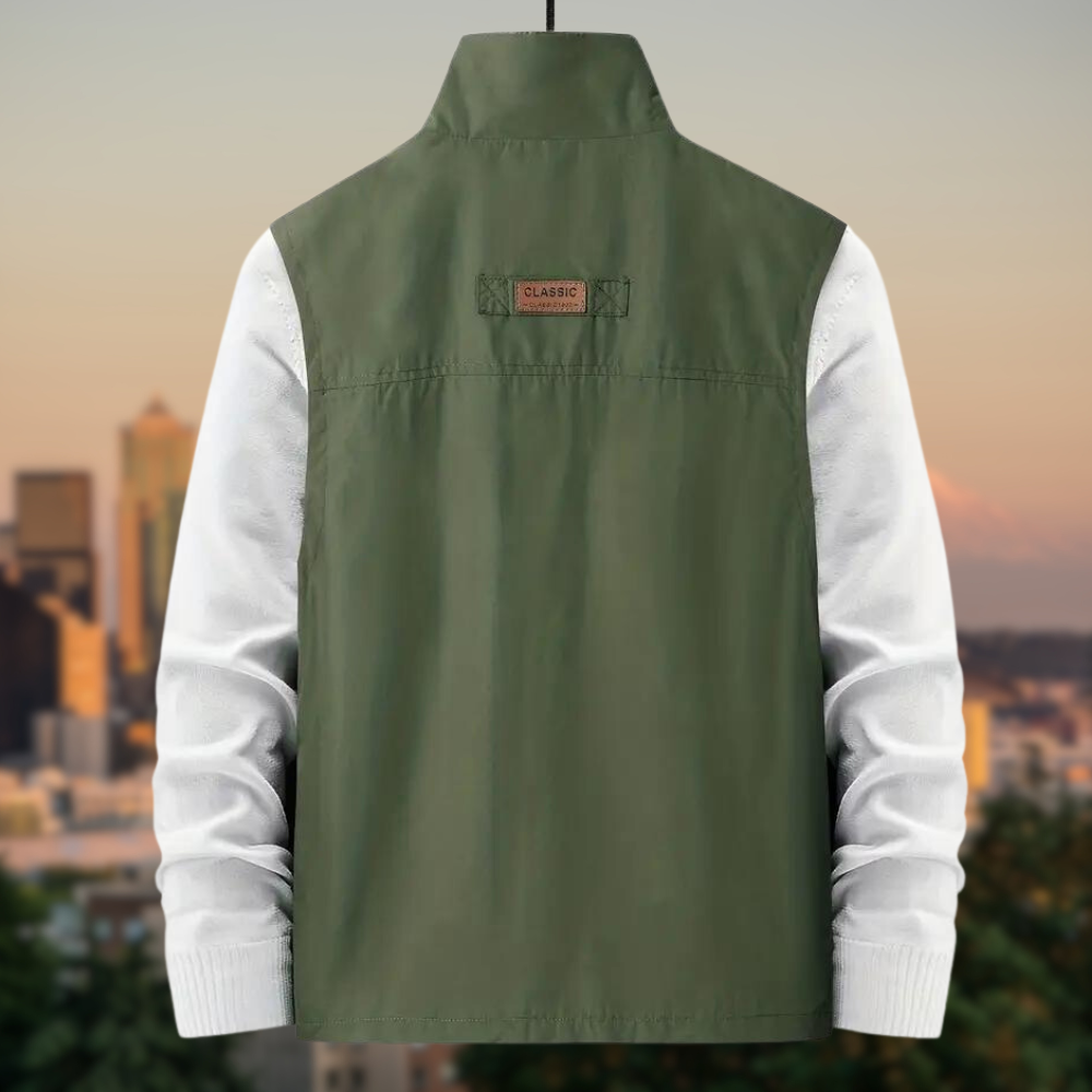 A man wearing the men's multi-pocket vest in a smart casual setting.