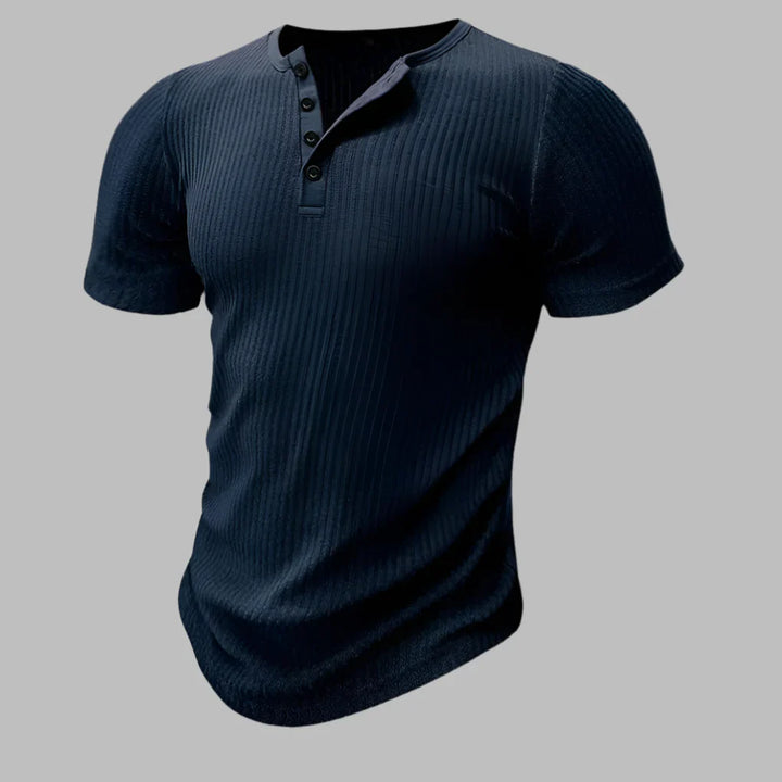 Model wearing a men's slim fit henley t-shirt, showcasing its stylish, athletic silhouette.