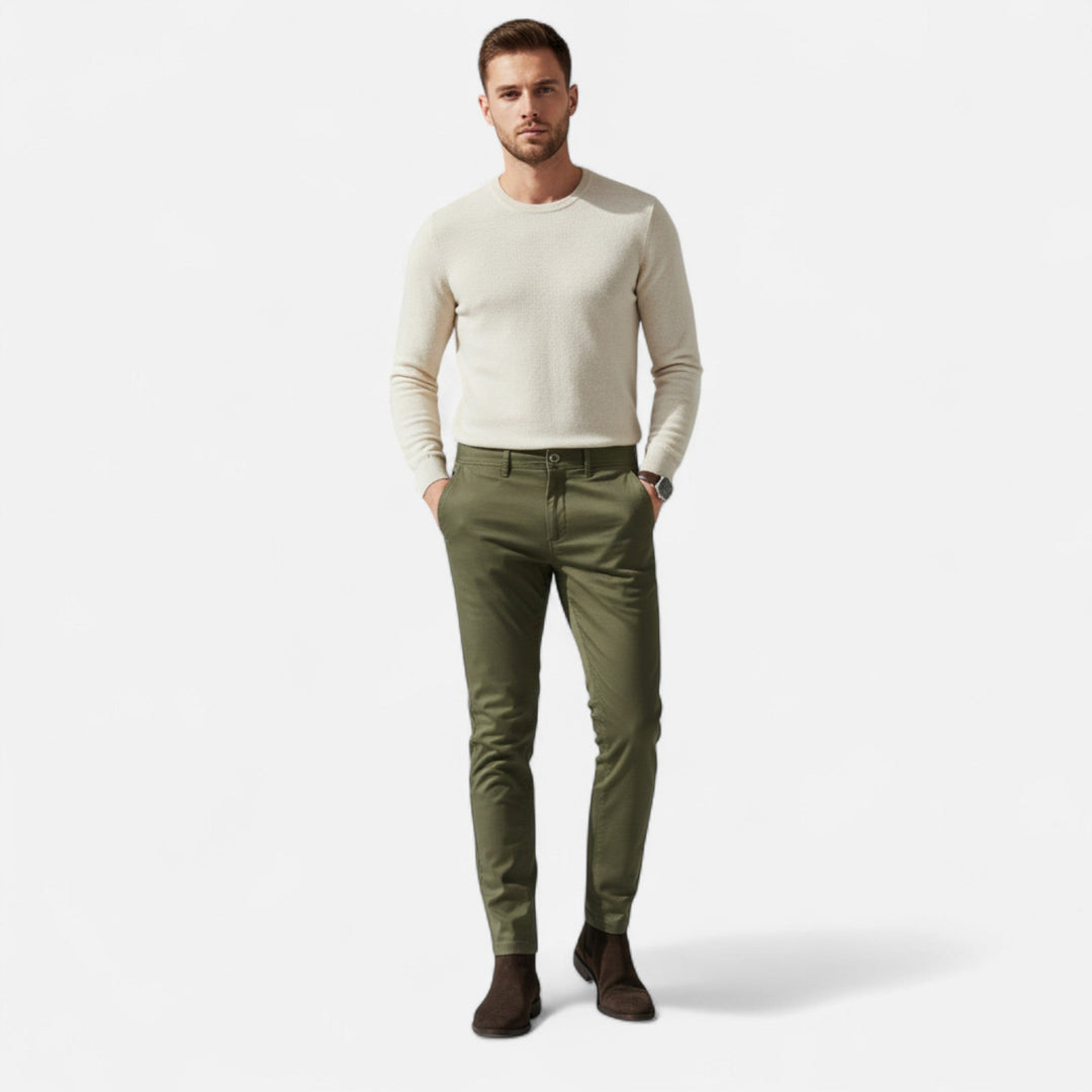 Close-up of men's tailored smart casual chinos, showing fabric texture and stitching.