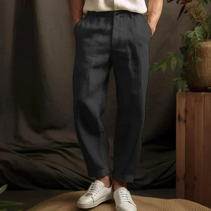 Relaxed fit men's linen trousers in neutral color. Ideal casual wear for warm weather & summer holidays.