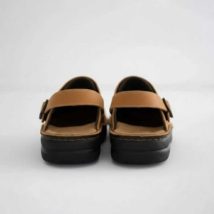 Side view of men's casual leather clogs with orthopaedic features for superior comfort and support.