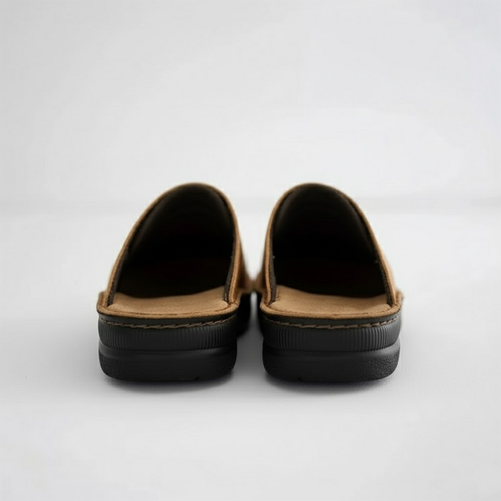 A man wearing comfortable men's orthopaedic slip-on clogs for everyday wear, highlighting casual style.