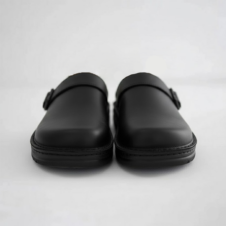 Detail of the genuine leather upper on men's orthopaedic clogs, emphasizing quality and durability.