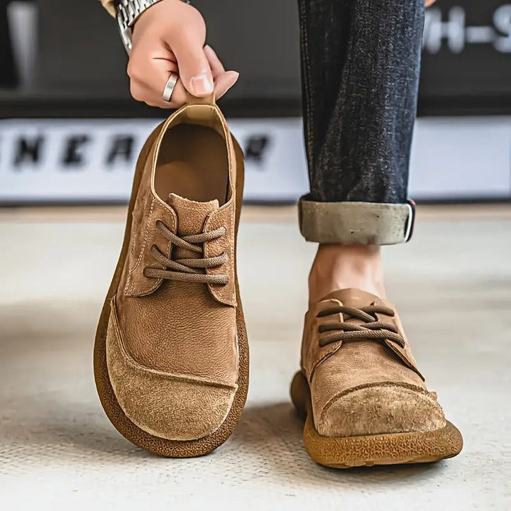 Close-up of fabric on men's cushioned orthopedic shoes, highlighting comfort, style & foot support.