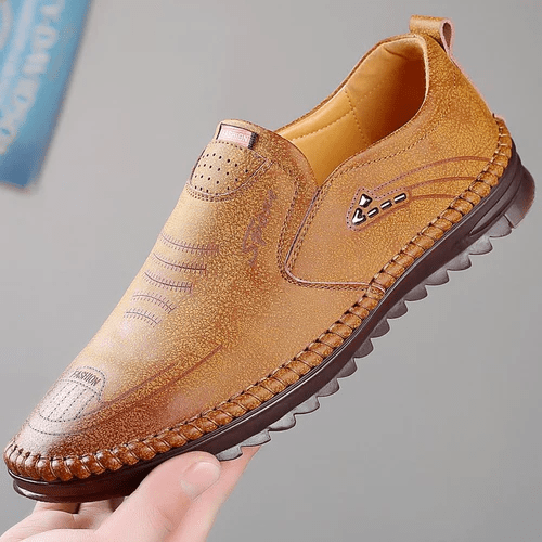 Front view of men's comfort shoes, showcasing breathable material, orthopedic design, & arch support for daily wear.