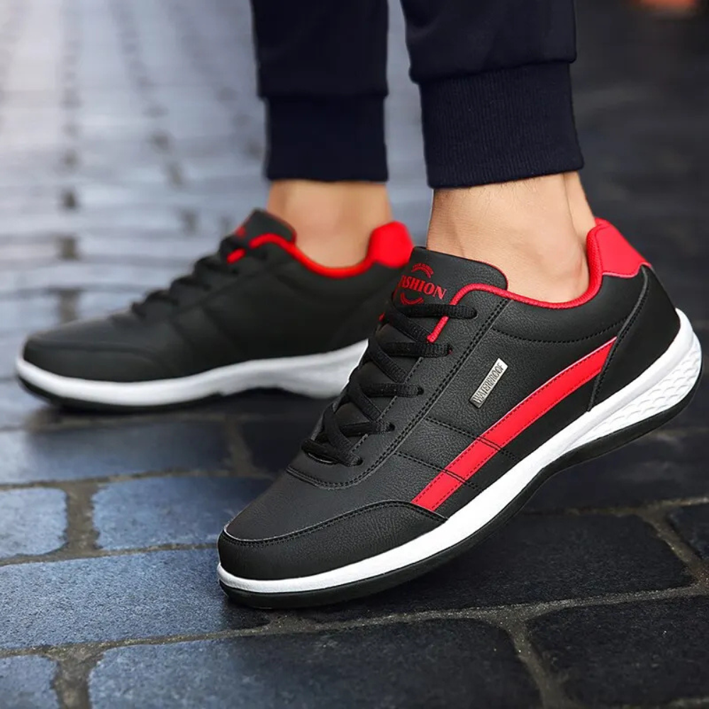 Pair of men's casual orthopedic sneakers, highlighting cushioned sole & arch support for foot comfort.