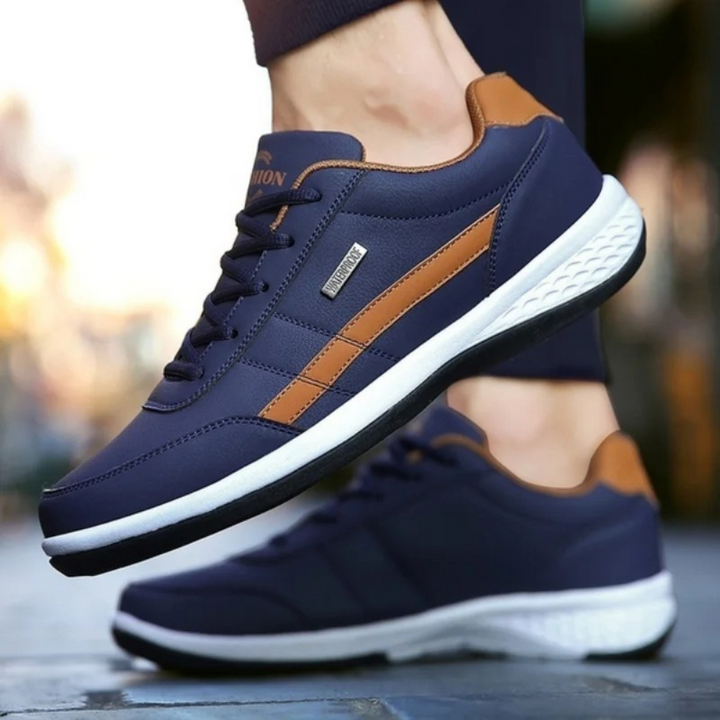 Side profile of men's comfort sneakers, detailing ergonomic design & orthopedic features for foot support.