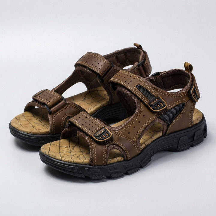 Adjustable men's perforated sandals providing essential orthopedic support & breathability for walks.