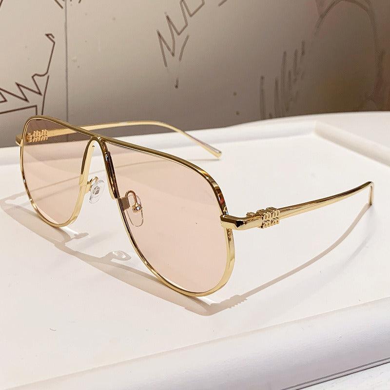 Unique men's oversized aviator sunglasses, luxurious metallic frame & striking gradient lenses. UV protected.