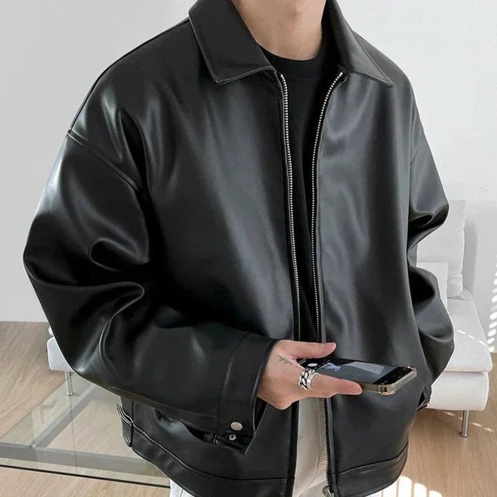 Close-up of the premium leather on a men's oversized streetwear bomber jacket.