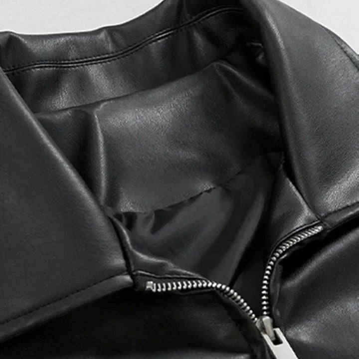 Model wearing a stylish men's oversized leather bomber jacket for urban fashion.
