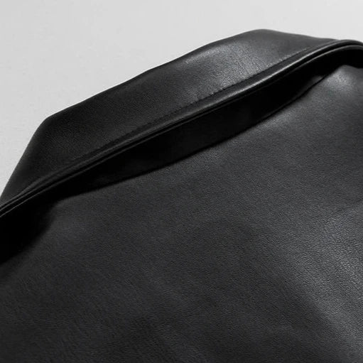Back detail of an oversized men's leather bomber jacket, showcasing urban design.