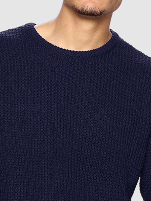 Man wearing a relaxed fit oversized crew neck sweater. Ideal for casual fall/winter style.