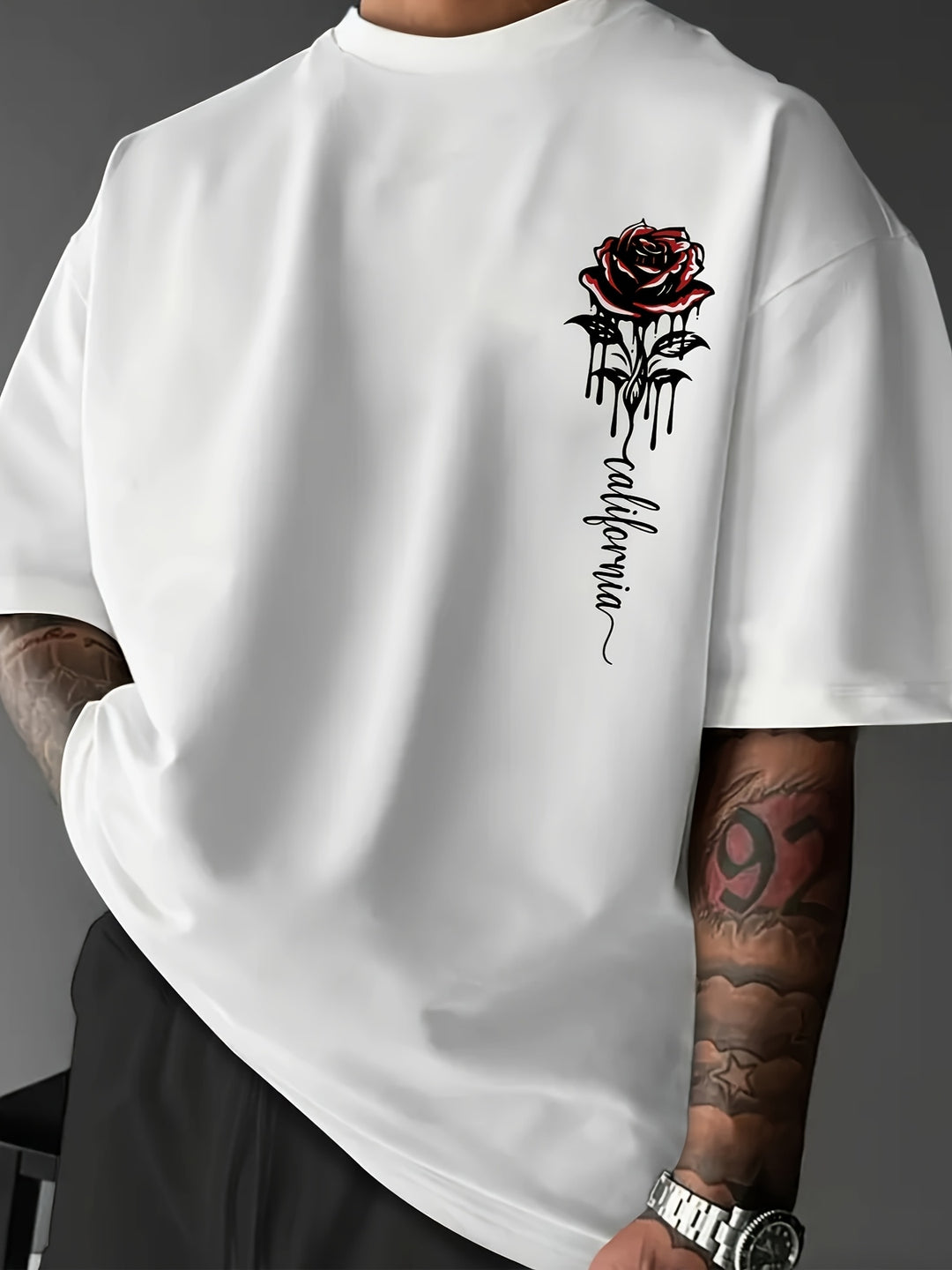Men's oversized streetwear t-shirt with a bold rose print graphic.