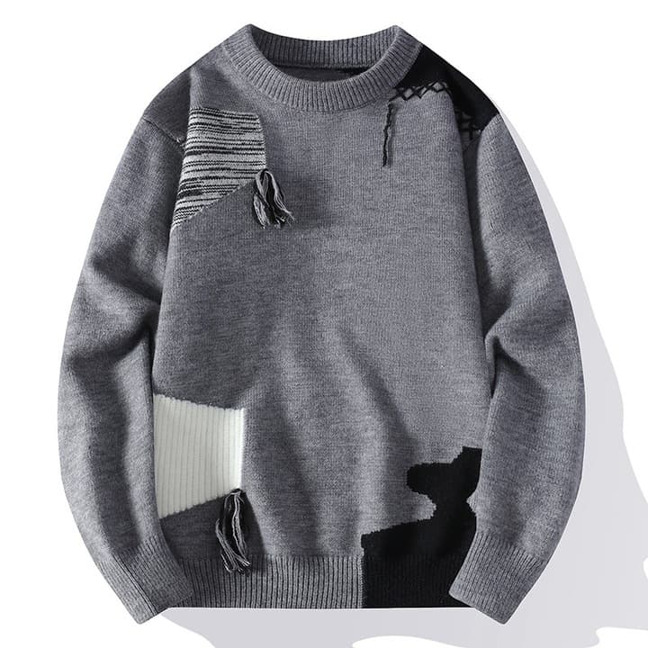 Edgy men's oversized sweater with unique distressed patchwork and tassels, a stylish choice for casual wear.