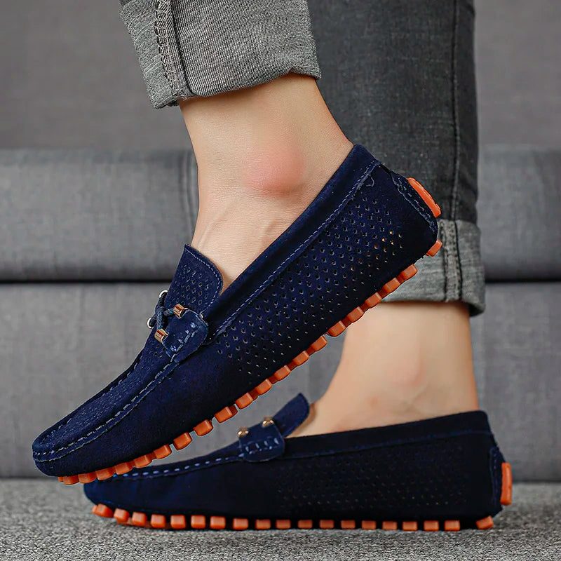 Comfortable men's slip-on loafers with perforated design for breathability and easy wear.