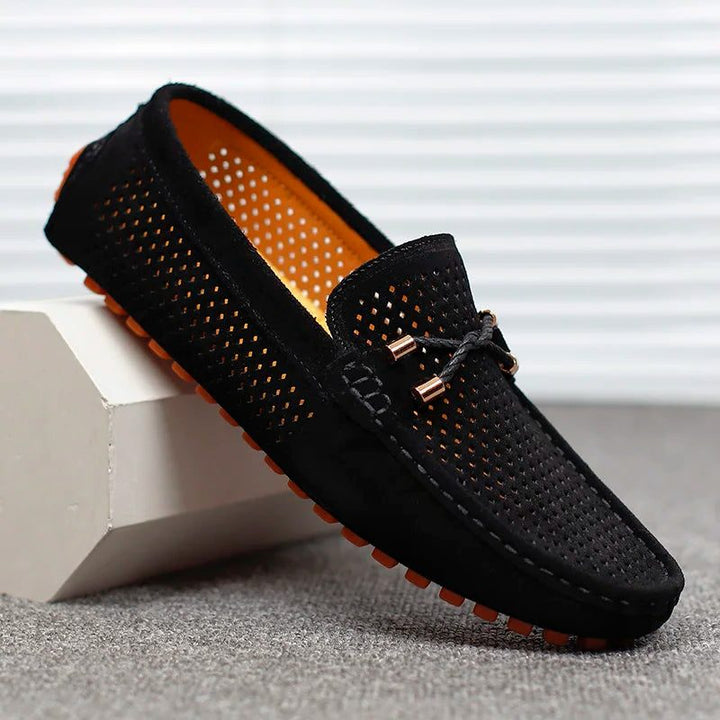 Breathable perforated slip-on loafers for men, offering cool comfort and casual elegance.
