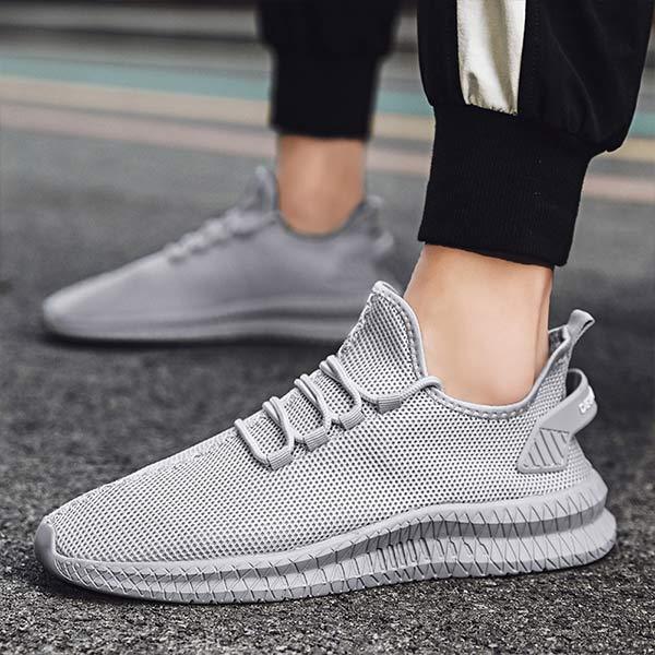 Stylish men's running footwear, superior comfort & support for all athletic activities.