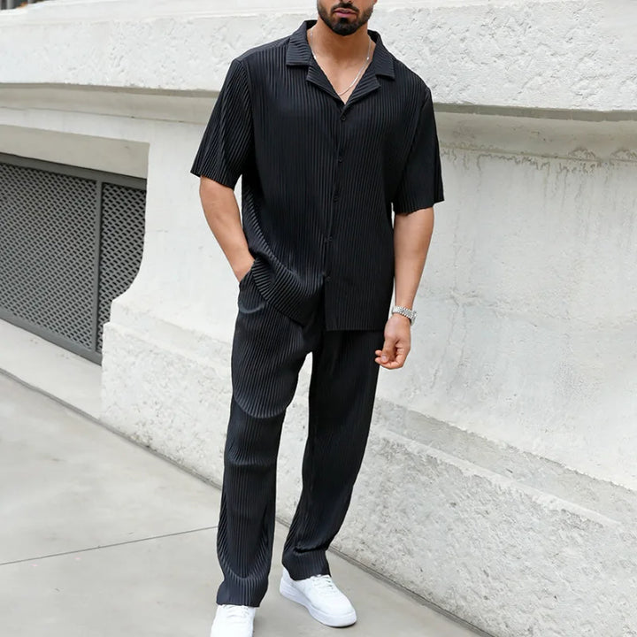 Stylish men's pleated two-piece set. Short sleeve camp collar shirt and straight leg trousers for spring/summer.