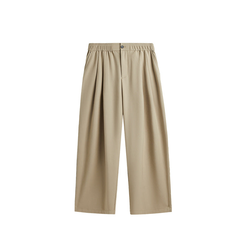 Comfortable men's casual trousers: pleated, wide leg, drawstring. Perfect for modern, relaxed style.