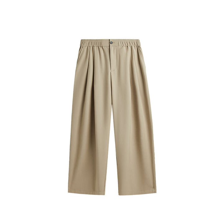 Comfortable men's casual trousers: pleated, wide leg, drawstring. Perfect for modern, relaxed style.