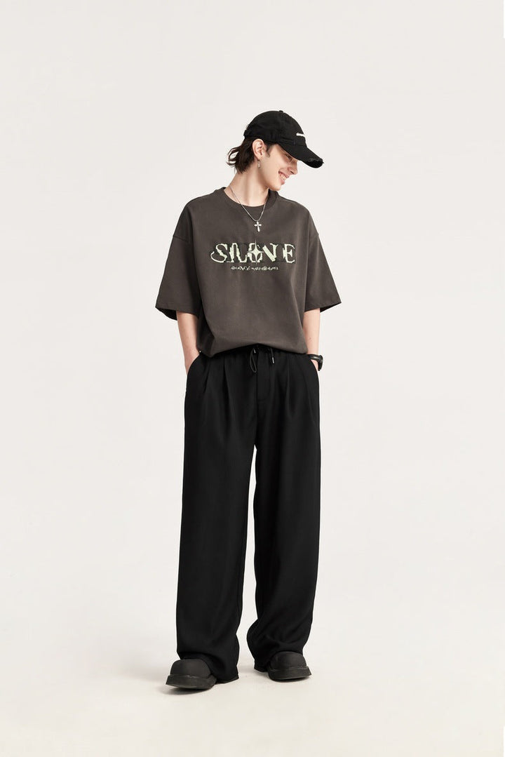 Casual men's wide leg drawstring pants with pleats. Comfortable, versatile men's fashion trousers.