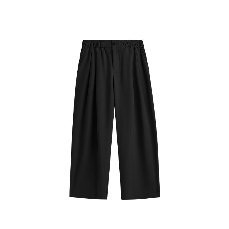 Men's relaxed fit wide leg drawstring pants. Pleated design for casual, comfortable men's fashion.