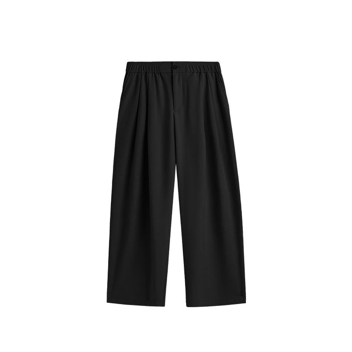 Men's relaxed fit wide leg drawstring pants. Pleated design for casual, comfortable men's fashion.