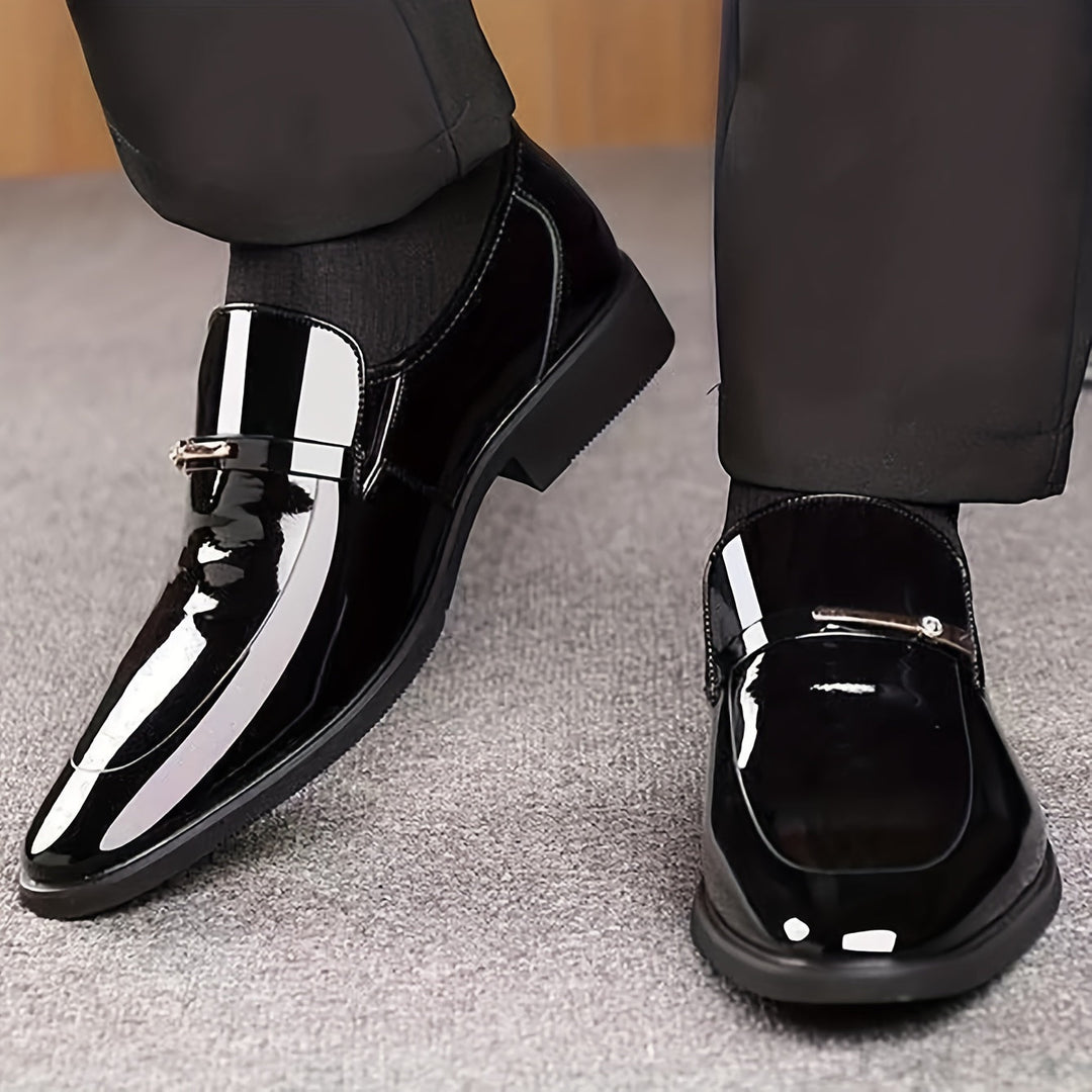Men's pointed toe slip-on penny loafers, ideal for formal wear and office attire. Sleek design.