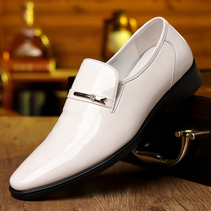 Sophisticated men's penny loafers. Pointed toe slip-on design for formal events, dress shoes collection.