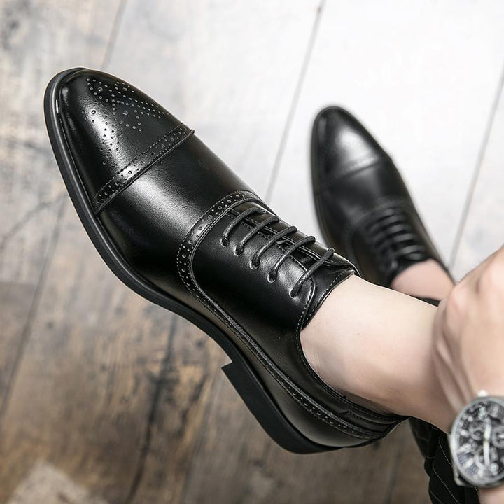 Classic men's polished leather brogue oxford shoes, sophisticated formal footwear for any business or event.