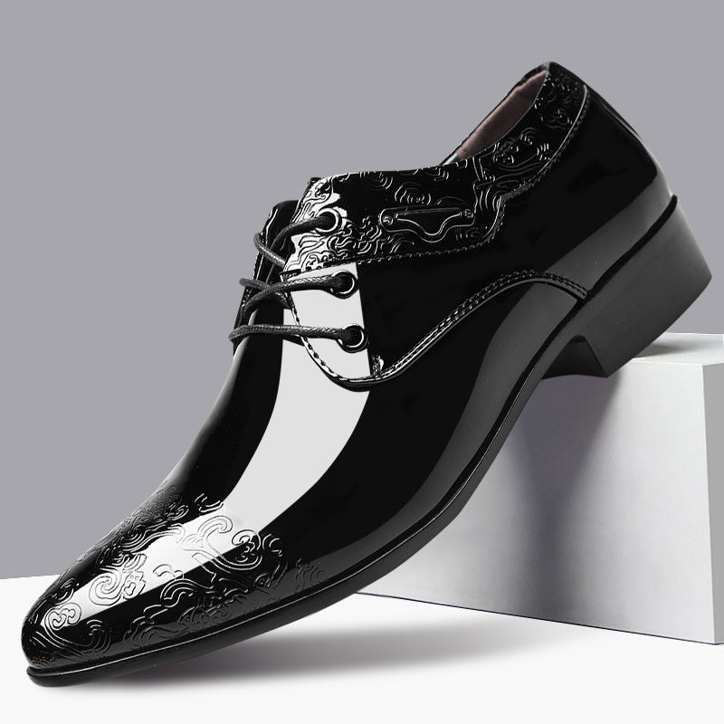Men's polished black leather derby shoes with elegant embossed detailing and lace-up closure, ideal for formal wear.